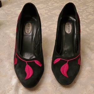 Black suede with red flower detail.